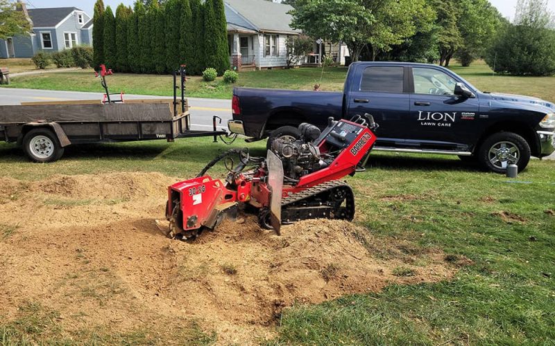 red work equipment for lawn installation and work truck