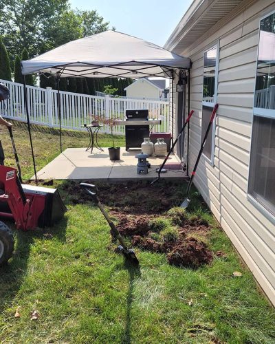 Lionscape professionals working on landscaping of lawn